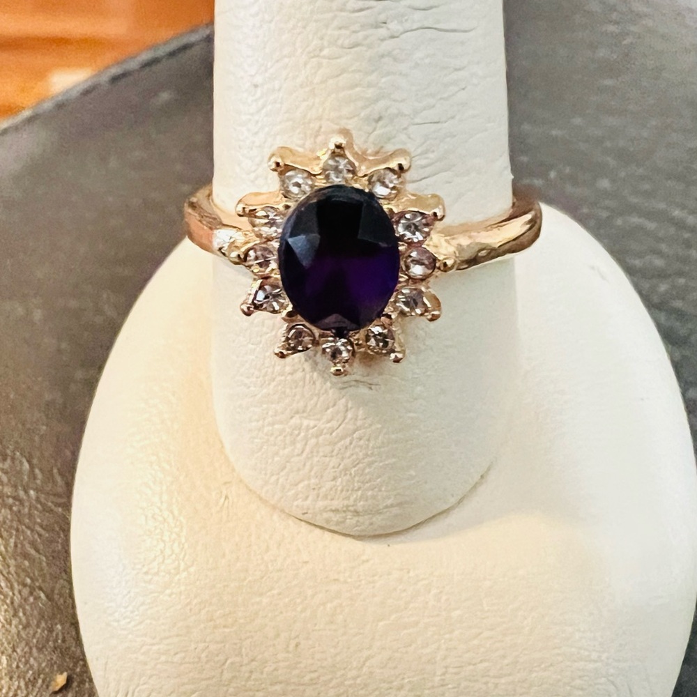 Gold Ring with Deep Purple Oval Gem and Halo Accents